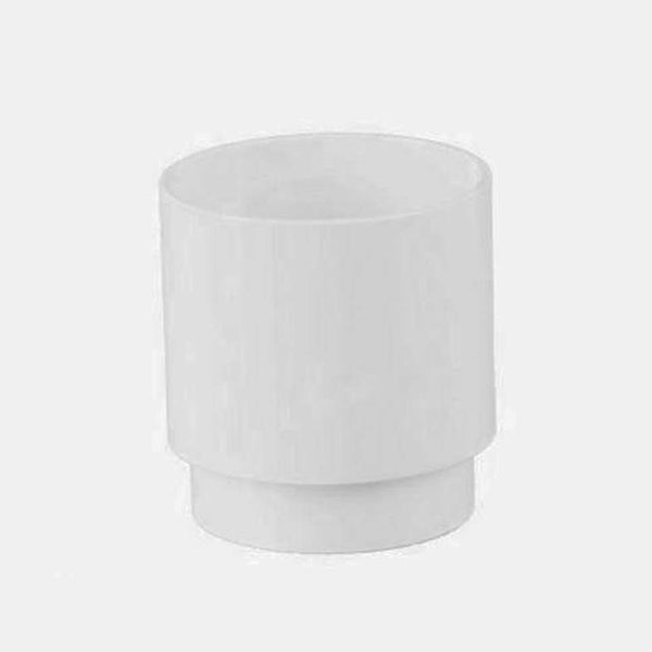 White PVC pipe connector coupler fitting on plain background
