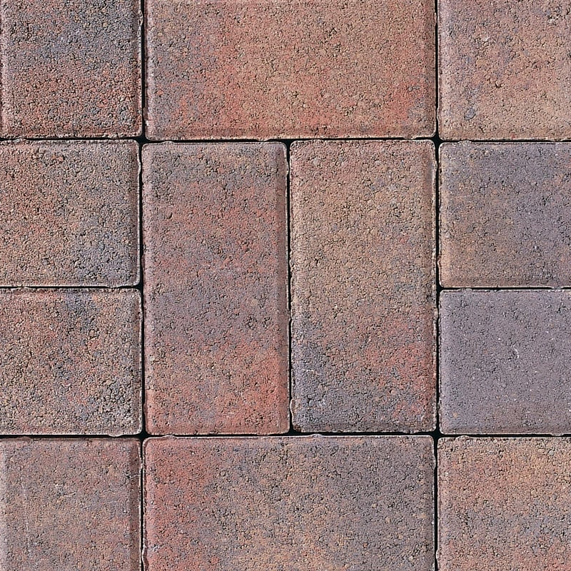 Close-up of textured concrete paving slabs with a rustic red and grey finish for patios or driveways