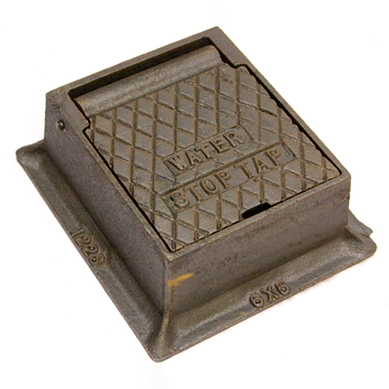 Cast iron water stop tap cover with diamond pattern and labeled text for outdoor plumbing