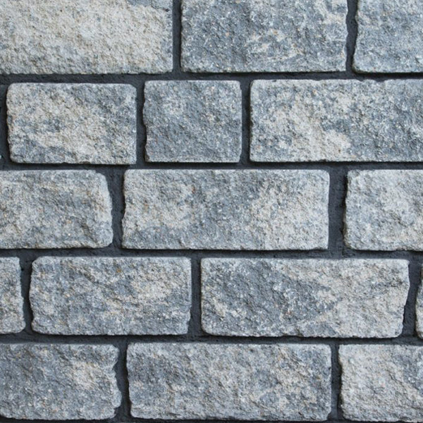 Rough textured grey stone wall blocks for construction and landscaping projects