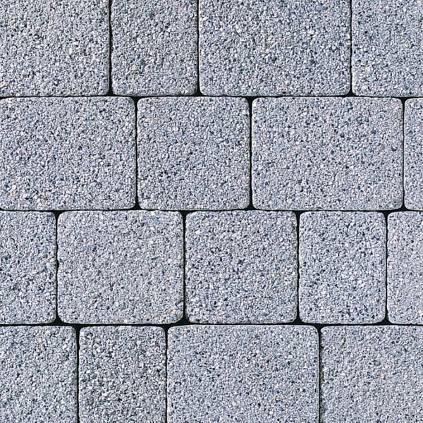 Close-up of grey concrete paving slabs arranged in a grid pattern for outdoor landscaping