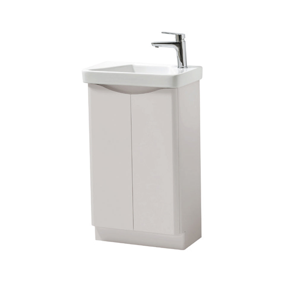 Compact white corner bathroom vanity unit with sink and chrome mixer tap