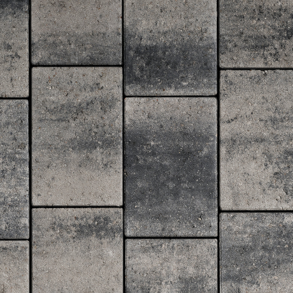 Textured grey concrete paving blocks for patio or driveway, building materials product