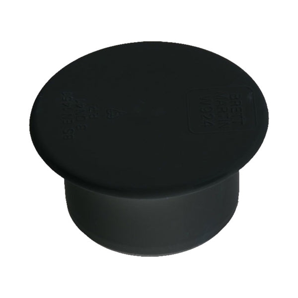 Black plastic pipe end cap for plumbing or drainage systems, isolated on white background
