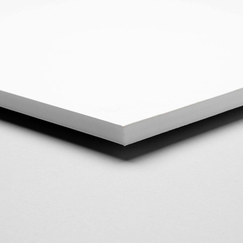 Close-up of white PVC foam board sheet, smooth surface, building material for trade and DIY