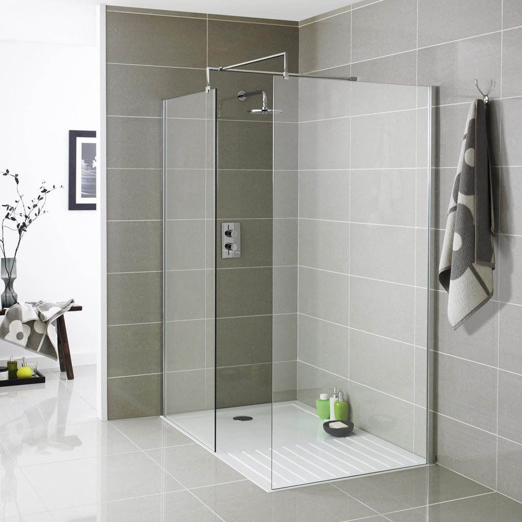 Modern walk-in glass shower enclosure with grey tiles and chrome rainfall shower head