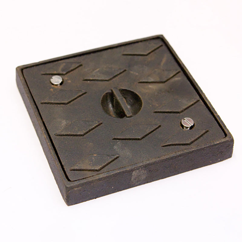 Square cast iron inspection cover with diamond tread pattern and two screws, construction supply