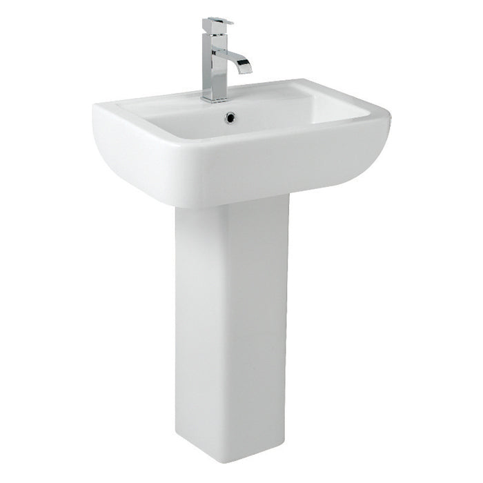 Modern white pedestal bathroom basin with chrome single lever tap
