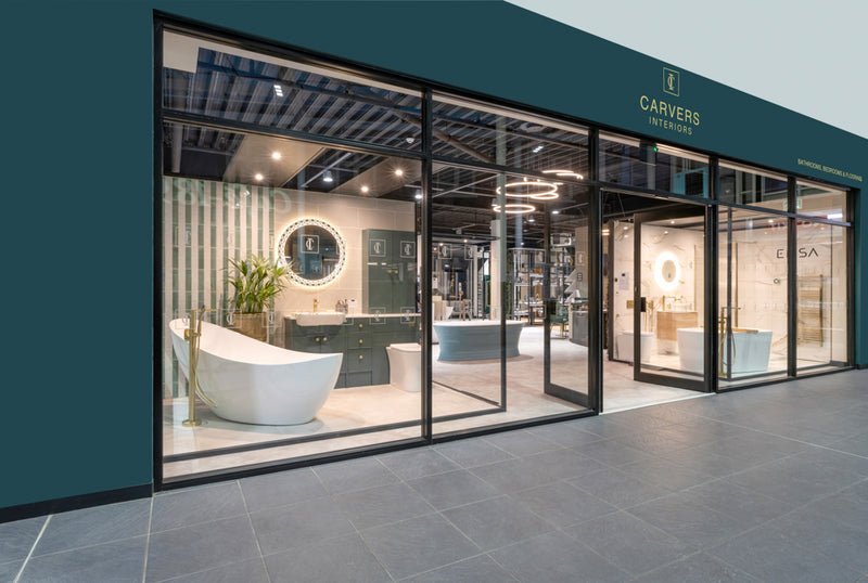 Modern bathroom and kitchen showroom exterior with large glass windows and stylish displays