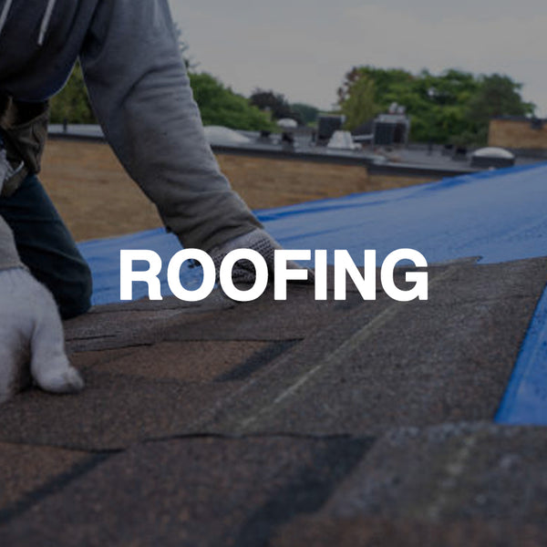 Worker installing roof shingles with blue tarp, roofing materials close-up